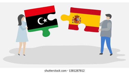 Couple holding two puzzles pieces with Libyan and Spanish flags. Libya and Spain national symbols together.