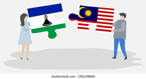 Couple holding two puzzles pieces with Basotho and Malaysian flags. Lesotho and Malaysia national symbols together.