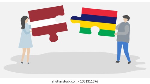 Couple holding two puzzles pieces with Latvian and Mauritian flags. Latvia and Mauritius national symbols together.