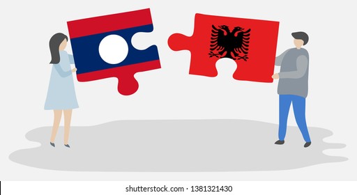 Couple holding two puzzles pieces with Lao and Albanian flags. Laos and Albania national symbols together.