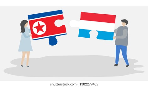 Couple holding two puzzles pieces with North Korean and Luxembourgish flags. North Korea and Luxembourg national symbols together.