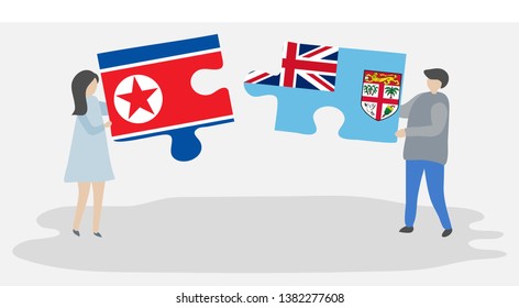 Couple holding two puzzles pieces with North Korean and Fijian flags. North Korea and Fiji national symbols together.