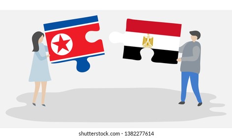 Couple holding two puzzles pieces with North Korean and Egyptian flags. North Korea and Egypt national symbols together.