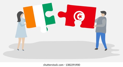 Couple holding two puzzles pieces with Ivorian and Tunisian flags. Ivory Coast and Tunisia national symbols together.