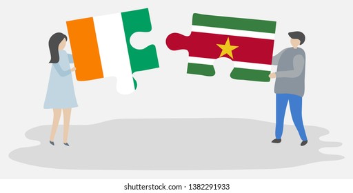 Couple holding two puzzles pieces with Ivorian and Surinamese flags. Ivory Coast and Suriname national symbols together.