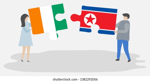 Couple holding two puzzles pieces with Ivorian and North Korean flags. Ivory Coast and North Korea national symbols together.