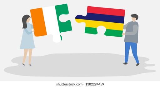 Couple holding two puzzles pieces with Ivorian and Mauritian flags. Ivory Coast and Mauritius national symbols together.