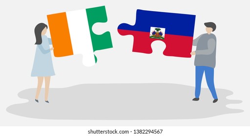 Couple holding two puzzles pieces with Ivorian and Haitian flags. Ivory Coast and Haiti national symbols together.