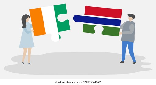 Couple holding two puzzles pieces with Ivorian and Gambian flags. Ivory Coast and Gambia national symbols together.
