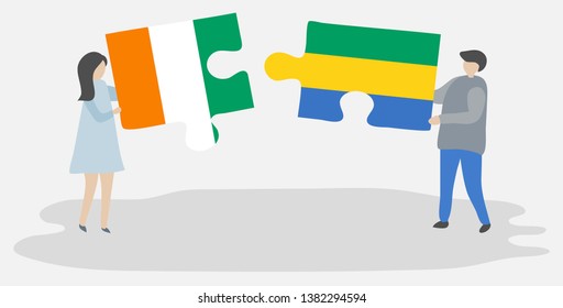 Couple holding two puzzles pieces with Ivorian and Gabonese flags. Ivory Coast and Gabon national symbols together.