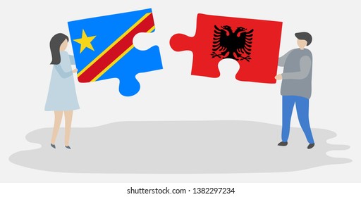 Couple holding two puzzles pieces with Congolese and Albanian flags. Democratic Republic of the Congo and Albania national symbols together.