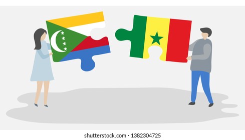 Couple holding two puzzles pieces with Comoran and Senegalese flags. Comoros and Senegal national symbols together.