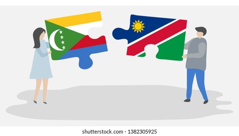 Couple holding two puzzles pieces with Comoran and Namibian flags. Comoros and Namibia national symbols together.