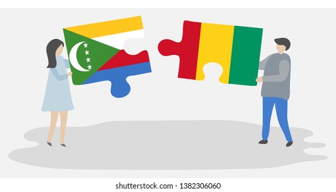 Couple holding two puzzles pieces with Comoran and Guinean flags. Comoros and Guinea national symbols together.