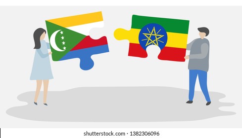 Couple holding two puzzles pieces with Comoran and Ethiopian flags. Comoros and Ethiopia national symbols together.