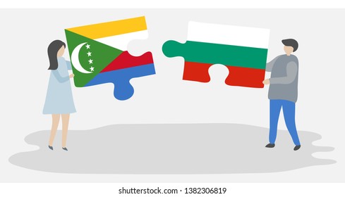 Couple holding two puzzles pieces with Comoran and Bulgarian flags. Comoros and Bulgaria national symbols together.
