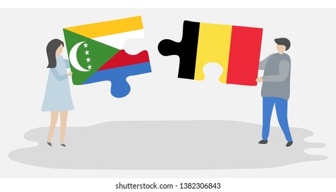 Couple holding two puzzles pieces with Comoran and Belgian flags. Comoros and Belgium national symbols together.