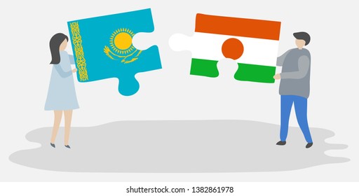 Couple holding two puzzles pieces with Kazakh and Nigerien flags. Kazakhstan and Niger national symbols together.