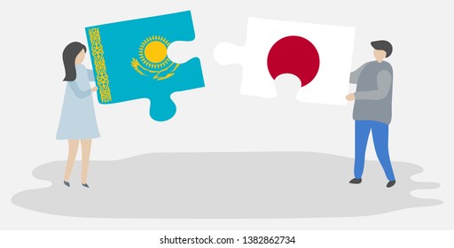 Couple holding two puzzles pieces with Kazakh and Japanese flags. Kazakhstan and Japan national symbols together.