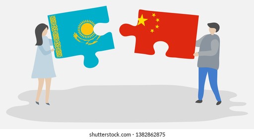 Couple holding two puzzles pieces with Kazakh and Chinese flags. Kazakhstan and China national symbols together.