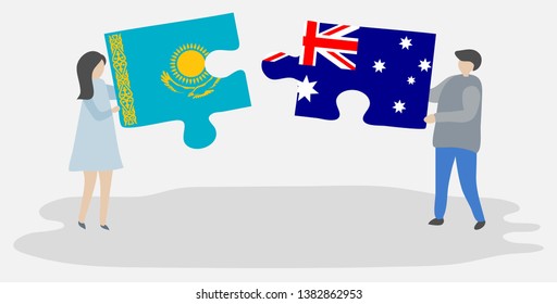 Couple holding two puzzles pieces with Kazakh and Australian flags. Kazakhstan and Australia national symbols together.