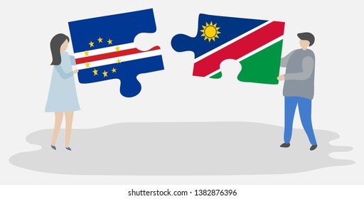 Couple holding two puzzles pieces with Cabo Verdean and Namibian flags. Cape Verde and Namibia national symbols together.