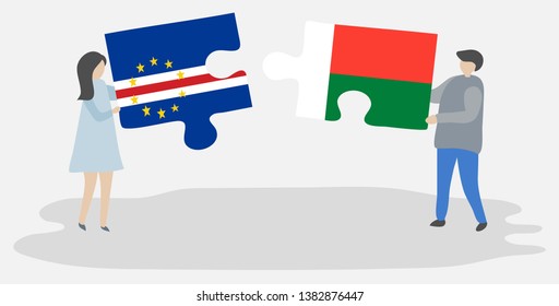 Couple holding two puzzles pieces with Cabo Verdean and Malagasy flags. Cape Verde and Madagascar national symbols together.