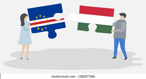 Couple holding two puzzles pieces with Cabo Verdean and Hungarian flags. Cape Verde and Hungary national symbols together.