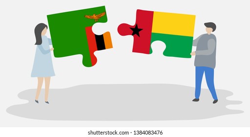 Couple holding two puzzles pieces with Zambian and Bissau-Guinean flags. Zambia and Guinea-Bissau national symbols together.