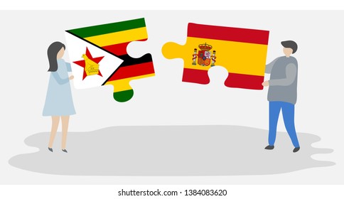 Couple holding two puzzles pieces with Zimbabwean and Spanish flags. Zimbabwe and Spain national symbols together.