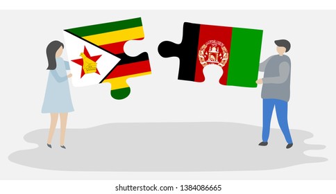 Couple holding two puzzles pieces with Zimbabwean and Afghan flags. Zimbabwe and Afghanistan national symbols together.