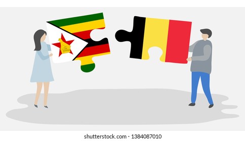Couple holding two puzzles pieces with Zimbabwean and Belgian flags. Zimbabwe and Belgium national symbols together.