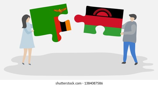 Couple holding two puzzles pieces with Zambian and Malawian flags. Zambia and Malawi national symbols together.