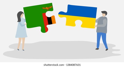 Couple holding two puzzles pieces with Zambian and Ukrainian flags. Zambia and Ukraine national symbols together.