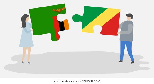Couple holding two puzzles pieces with Zambian and Congolese flags. Zambia and Republic of the Congo national symbols together.