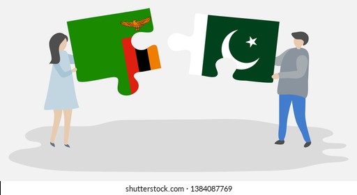 Couple holding two puzzles pieces with Zambian and Pakistani flags. Zambia and Pakistan national symbols together.