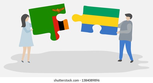 Couple holding two puzzles pieces with Zambian and Gabonese flags. Zambia and Gabon national symbols together.