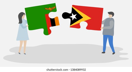 Couple holding two puzzles pieces with Zambian and Timorese flags. Zambia and East Timor national symbols together.