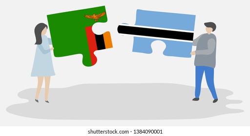 Couple holding two puzzles pieces with Zambian and Motswana flags. Zambia and Botswana national symbols together.