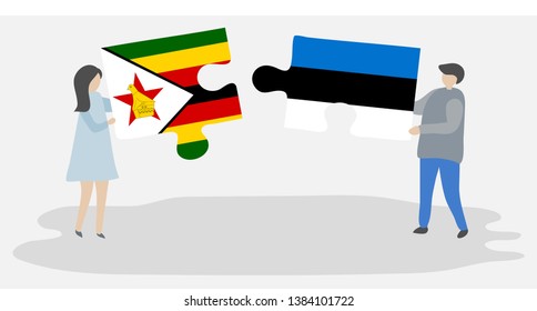 Couple holding two puzzles pieces with Zimbabwean and Estonian flags. Zimbabwe and Estonia national symbols together.