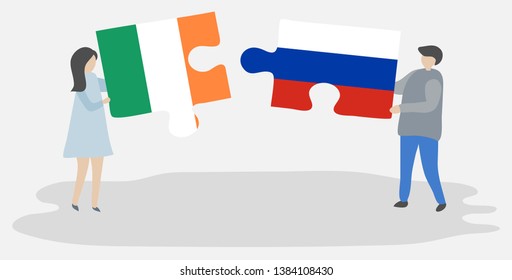 Couple holding two puzzles pieces with Irish and Russian flags. Ireland and Russia national symbols together.