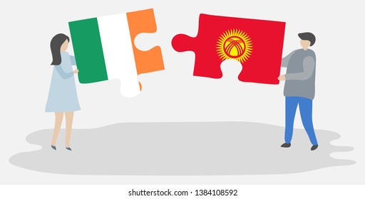 Couple holding two puzzles pieces with Irish and Kirgiz flags. Ireland and Kyrgyzstan national symbols together.