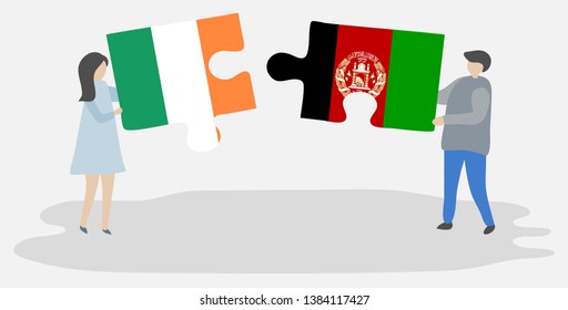 Couple holding two puzzles pieces with Irish and Afghan flags. Ireland and Afghanistan national symbols together.