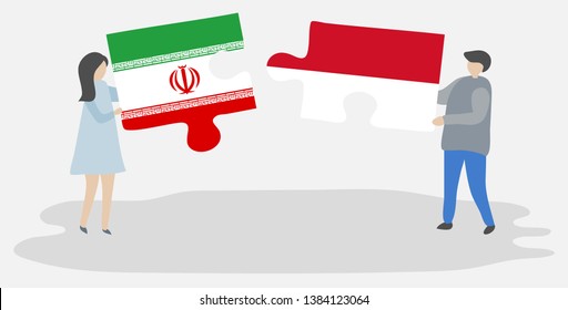 Couple holding two puzzles pieces with Iranian and Indonesian flags. Iran and Indonesia national symbols together.