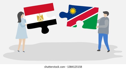 Couple holding two puzzles pieces with Egyptian and Namibian flags. Egypt and Namibia national symbols together.
