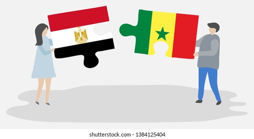 Couple holding two puzzles pieces with Egyptian and Senegalese flags. Egypt and Senegal national symbols together.