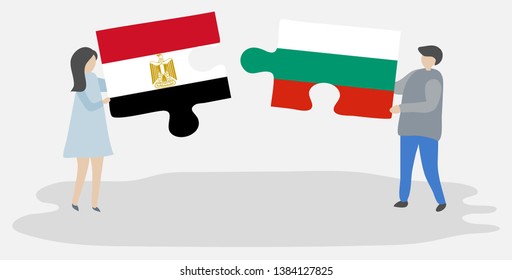 Couple holding two puzzles pieces with Egyptian and Bulgarian flags. Egypt and Bulgaria national symbols together.