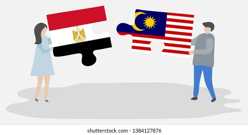 Couple holding two puzzles pieces with Egyptian and Malaysian flags. Egypt and Malaysia national symbols together.