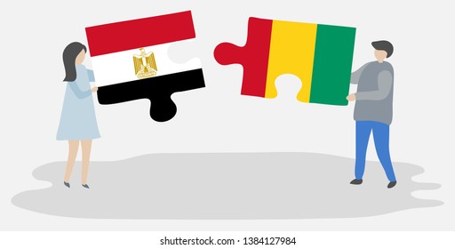 Couple holding two puzzles pieces with Egyptian and Guinean flags. Egypt and Guinea national symbols together.