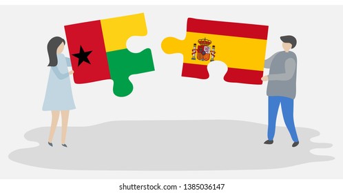 Couple holding two puzzles pieces with Bissau-Guinean and Spanish flags. Guinea-Bissau and Spain national symbols together.